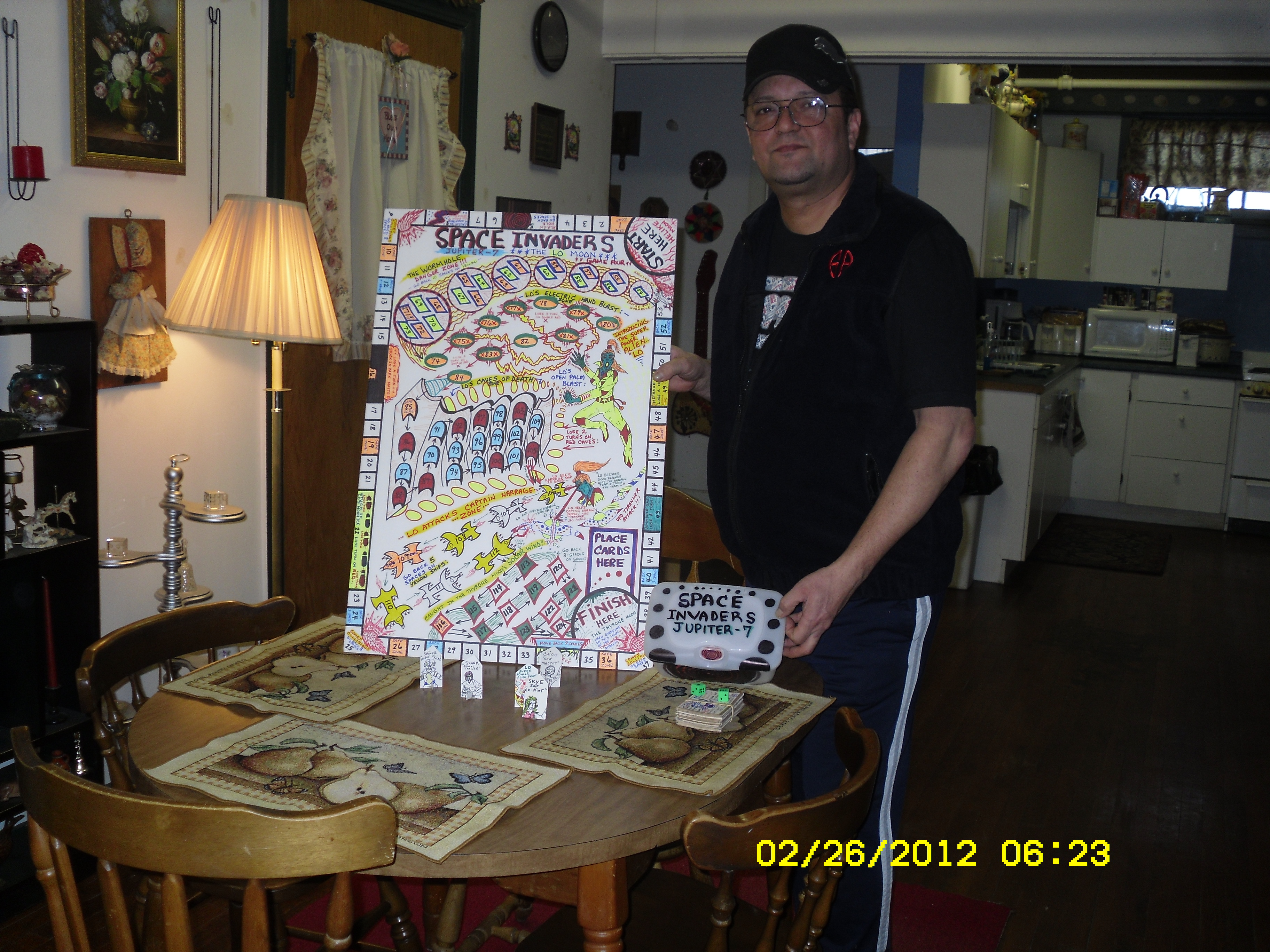 Me standing next to one of my completed board games...